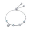 Bracelet Cristaux de Glace <titolo_esteso><span>en argent 925 plaqué or blanc ajustable avec zircons blancs et bleus</span></titolo_esteso>