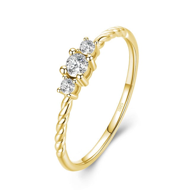 Bague Trilogie <titolo_esteso><span>en argent 925 plaqué or jaune avec zircons blancs</span></titolo_esteso>