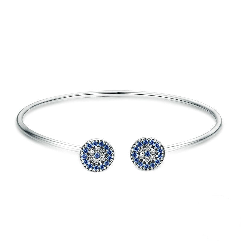 Bracelet Oeil d'Allah <titolo_esteso><span>jonc en argent 925 plaqué or blanc avec zircons blancs et bleus</span></titolo_esteso>