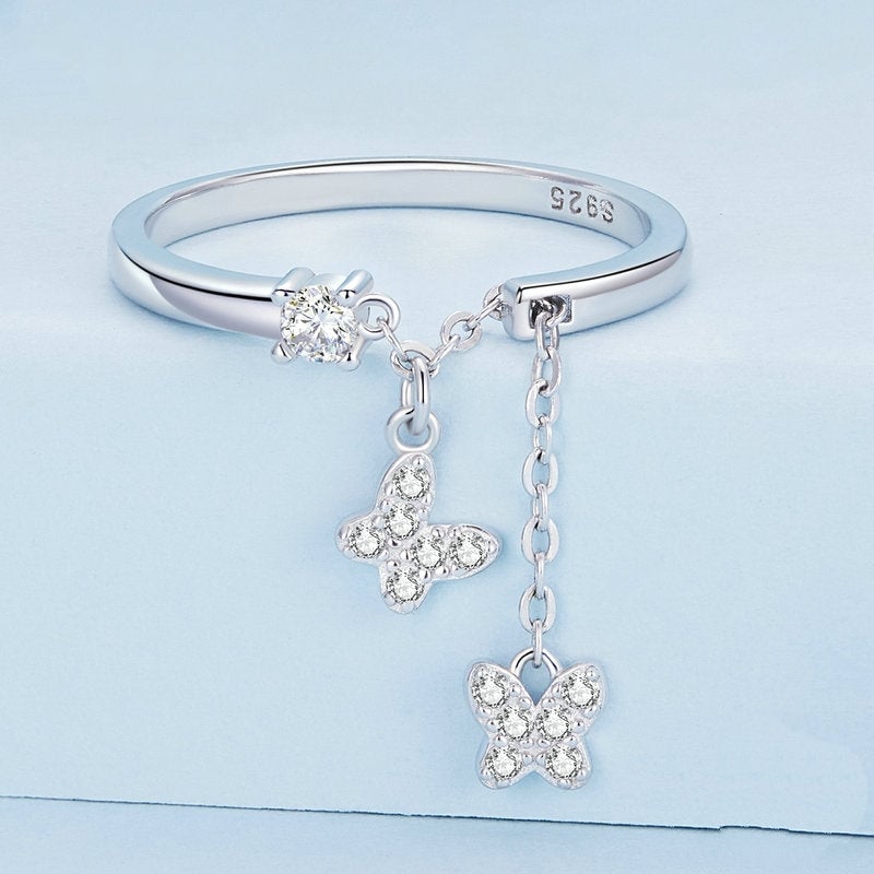 Bague Papillons <titolo_esteso><span>en argent 925 plaqué or blanc ajustable avec pendentifs et zircons blancs</span></titolo_esteso> - Image 3