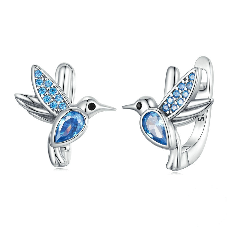 Boucles d'Oreilles Petits Oiseaux <titolo_esteso><span>en argent 925 plaqué or blanc avec zircons bleus</span></titolo_esteso>