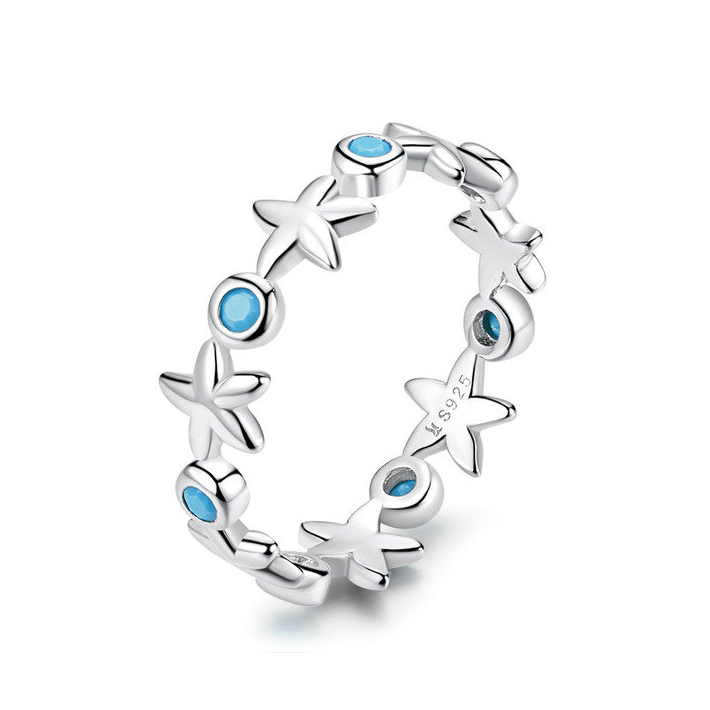 Bague Étoile de Mer <titolo_esteso><span>en argent 925 plaqué or blanc avec zircons bleus</span></titolo_esteso>