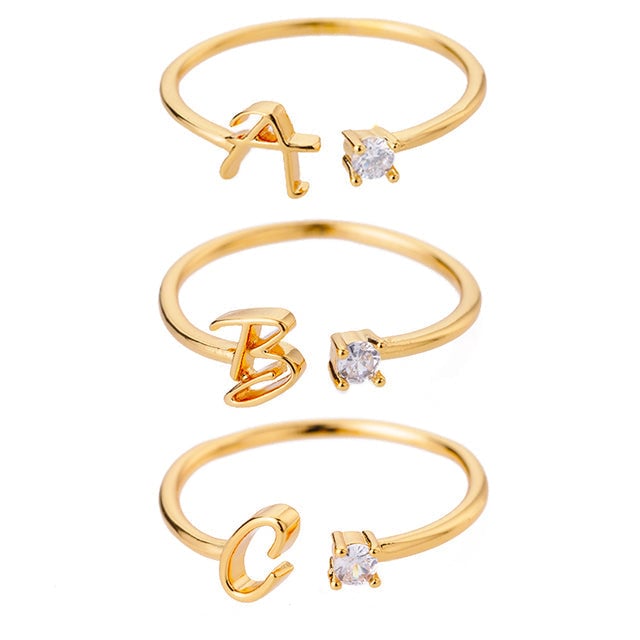 Bague avec Initiale <titolo_esteso><span>avec lettre ajustable en acier inoxydable plaqué or blanc, or jaune ou or rose avec zircons blancs</span></titolo_esteso>