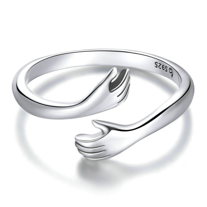 Bague Câlin d'Amour <titolo_esteso><span>en argent 925 plaqué or blanc ajustable avec étreinte et détail des mains</span></titolo_esteso>