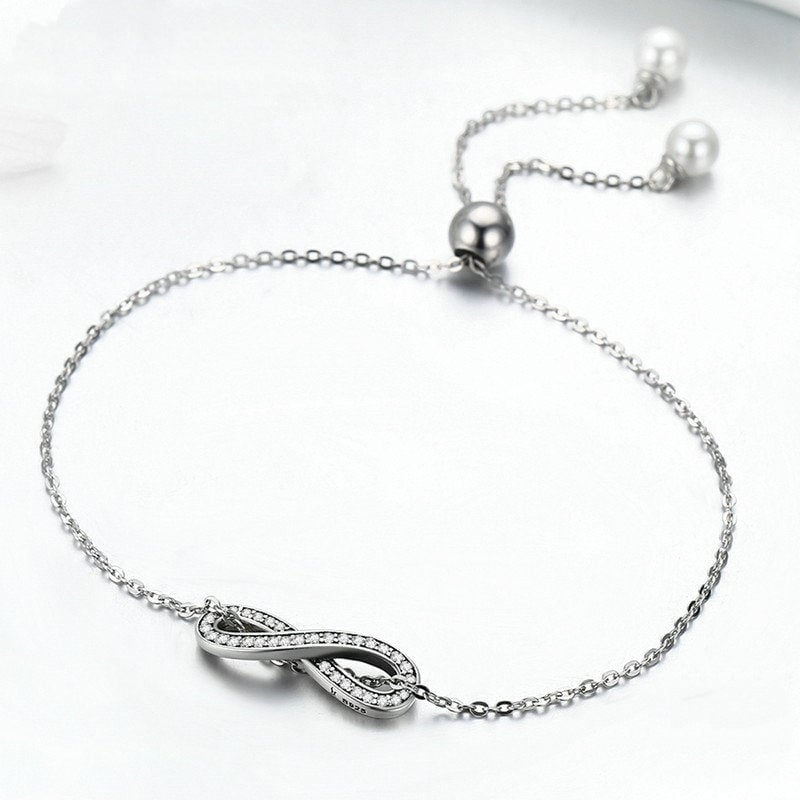 Bracelet Infini <titolo_esteso><span>en argent 925 plaqué or blanc ajustable avec zircons blancs et perles</span></titolo_esteso> - Image 3