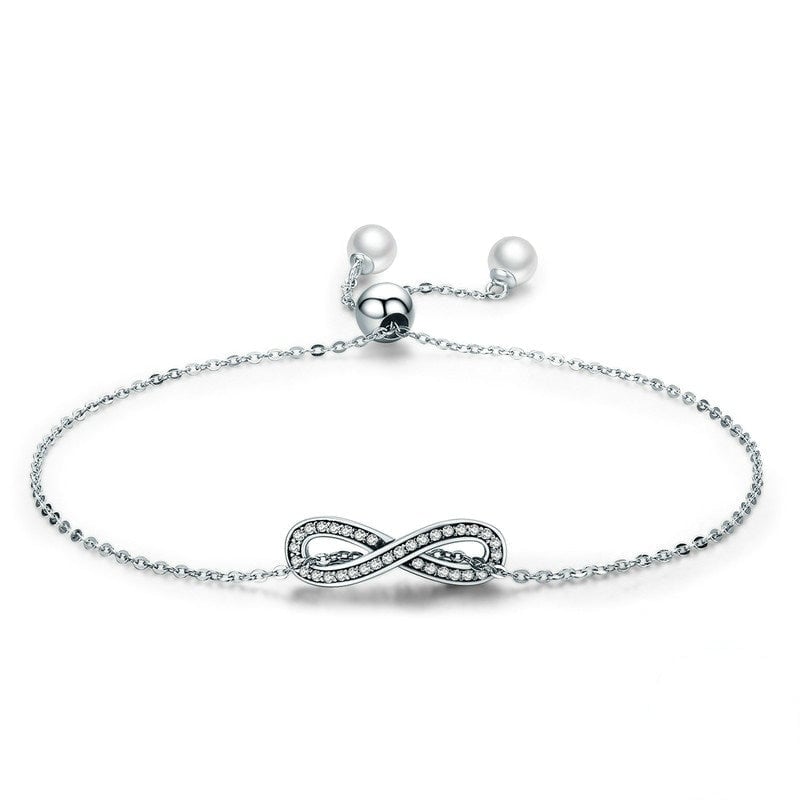 Bracelet Infini <titolo_esteso><span>en argent 925 plaqué or blanc ajustable avec zircons blancs et perles</span></titolo_esteso>