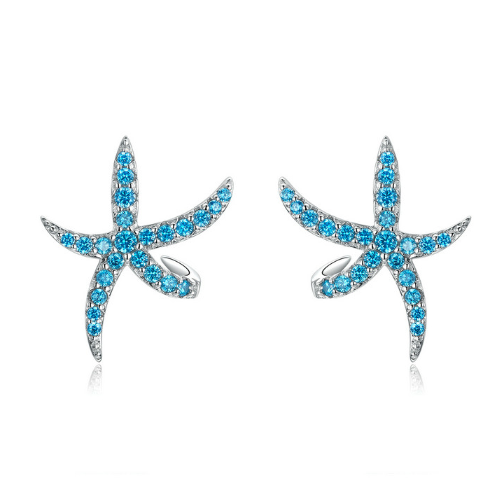 Boucles d'oreilles Étoile de Mer <titolo_esteso><span>en argent 925 plaqué or blanc avec pavé de zircons bleus</span></titolo_esteso>