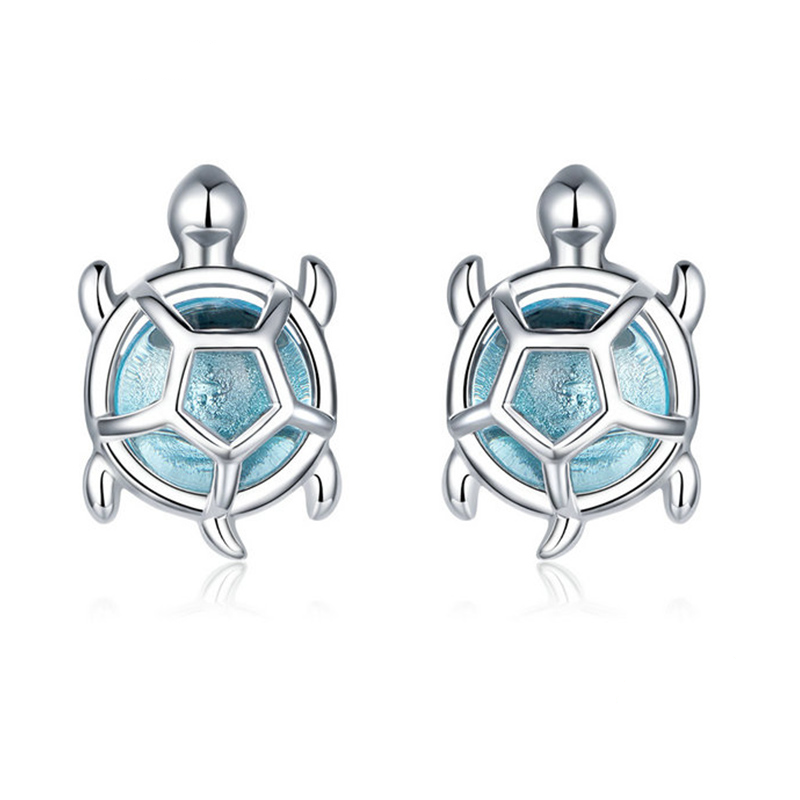 Boucles d'oreilles Tortue <titolo_esteso><span>en argent 925 plaqué or blanc avec zircons bleus</span></titolo_esteso>