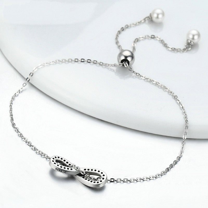 Bracelet Infini <titolo_esteso><span>en argent 925 plaqué or blanc ajustable avec zircons blancs et perles</span></titolo_esteso> - Image 4