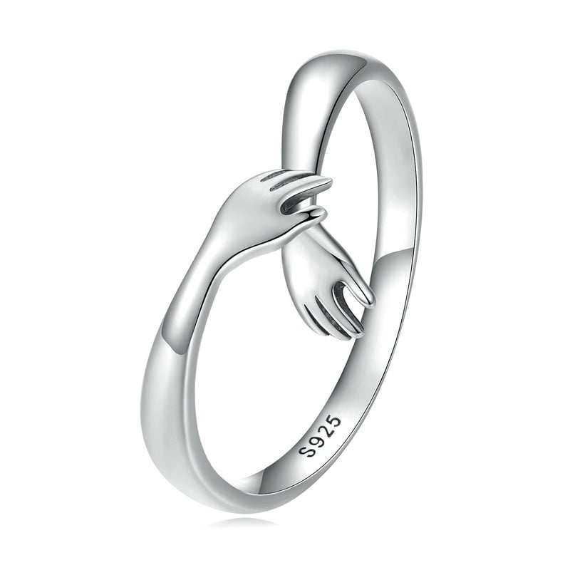 Bague Câlin <titolo_esteso><span>en argent 925 plaqué or blanc ajustable avec étreinte et détail des mains</span></titolo_esteso>