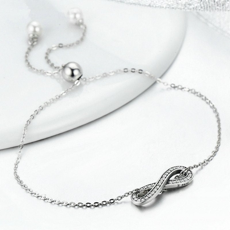 Bracelet Infini <titolo_esteso><span>en argent 925 plaqué or blanc ajustable avec zircons blancs et perles</span></titolo_esteso> - Image 5