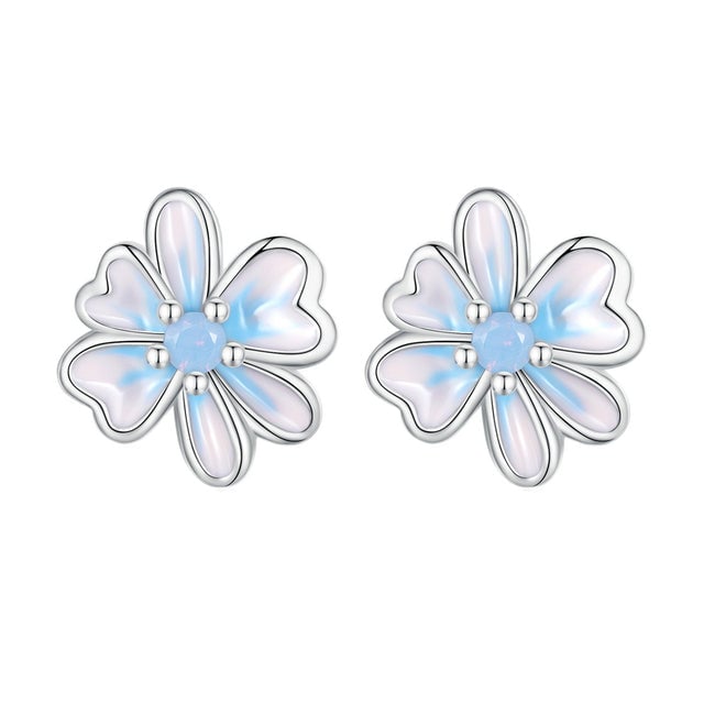 Boucles d'Oreilles Fleurs <titolo_esteso><span>en argent 925 plaqué or blanc émaillé à la main avec zircons bleus</span></titolo_esteso>