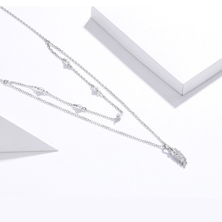 Collier Double avec Plume <titolo_esteso><span>en argent 925 plaqué or blanc ajustable avec zircons blancs et perles</span></titolo_esteso> - Image 4