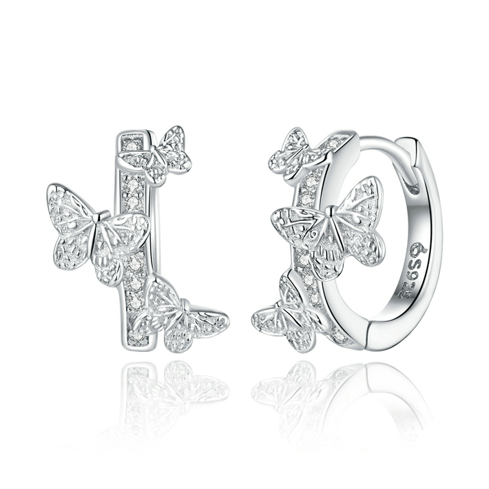 Boucles d’Oreilles Créoles Papillons <titolo_esteso><span>en argent 925 plaqué or blanc avec zircons blancs</span></titolo_esteso>