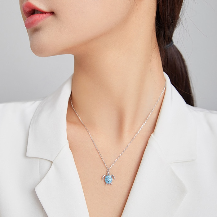 Collier Tortue <titolo_esteso><span>en argent 925 plaqué or blanc ajustable avec pendentif émaillé turquoise</span></titolo_esteso> - Image 2