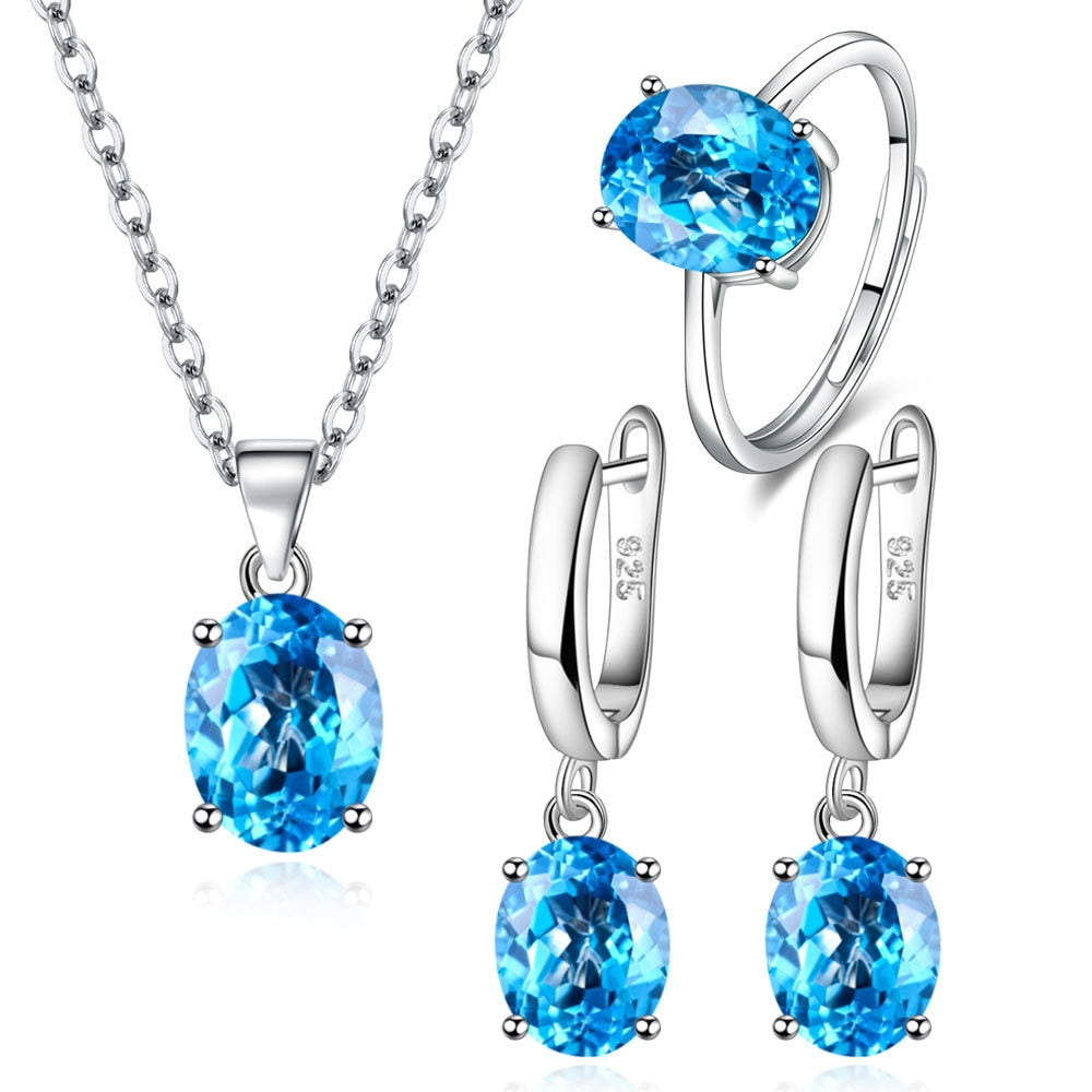 Parure de Bijoux <myopt><span>Argent Sterling 925 plaqué or blanc avec collier, boucles d’oreilles et bague ajustable avec zircons bleus</span></myopt>