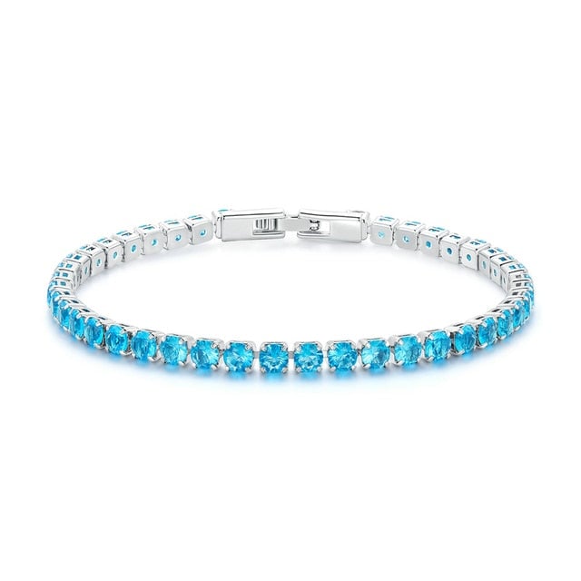 Bracelet Tennis <titolo_esteso><span>en acier inoxydable plaqué or blanc avec zircons bleus</span></titolo_esteso>
